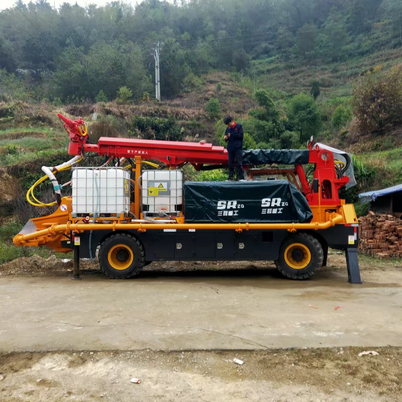 The wet spraying machine start working once the pipe shed at the tunnel entrance is erected 2 The wet spraying machine start working once the pipe shed at the tunnel entrance is erected 2